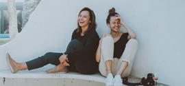 Two women laughing.